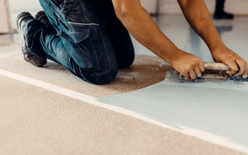 worker-putting-down-gray-epoxy